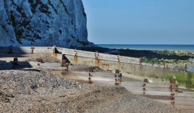 Breakwaters at the end of the beach.