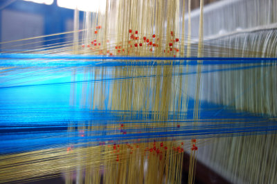 silk threads on a loom