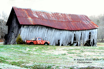 A TIRED BARN AND A VERY TIRED TRUCK