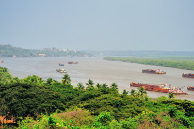 Mandovi River, With The Iron Ore Barges