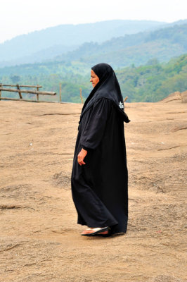 The Mysterious Woman In Black Reveals Herself!