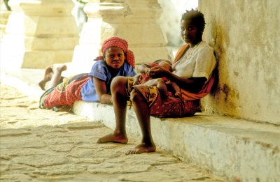 Feeding The Baby In The Shadows Of The Old Fortress