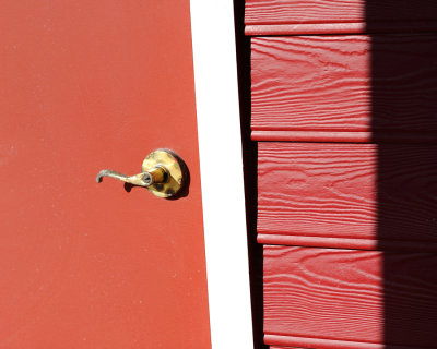 Brass Door Handle on Red Door