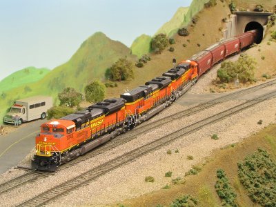 BNSF 8745 leading a trio of fantasy yellow wedgie SD70ACes.
