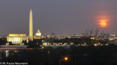 Full moon rising over the city of DC