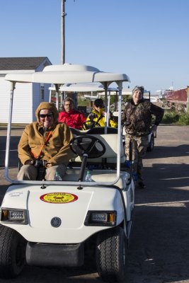 5.  Aboard the golf carts for a town run.