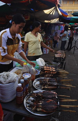 PhnomPen: market. BBQ squids.