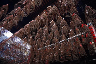 Saigon: chinese temple. Conic incense hanging from ceiling