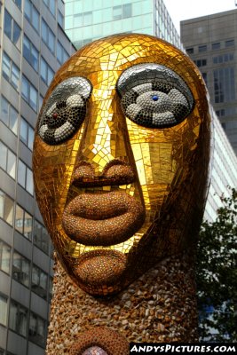 Golden face sculpture