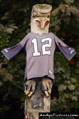 Wooden Seahawks totem pole with jersey