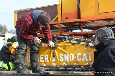 Tucker Sno-Cat axle under repair