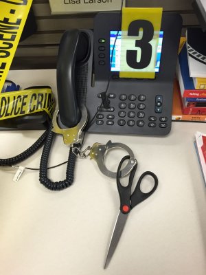 Scissors handcuffed to the phone