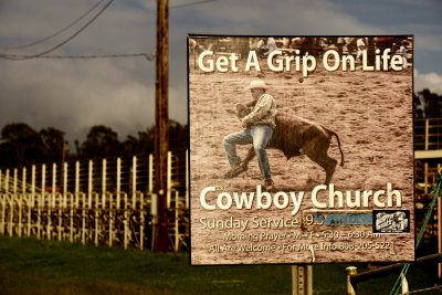 An ad for the Cowboy Church, a few miles west and up from Paia