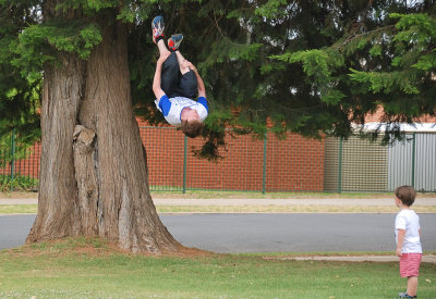Mitch impressing his 3 y.o. nephew with one of his tricks, backflip from the tree trunk.
