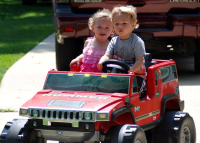 Brady and Bella riding the Hummer