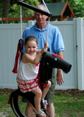 Addy being pushed by Papa