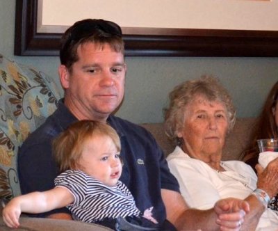 Cory's turn to hold Sophia (she really likes the men!)