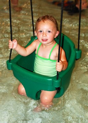 Bella liked to splash Grammy with her legs while swinging