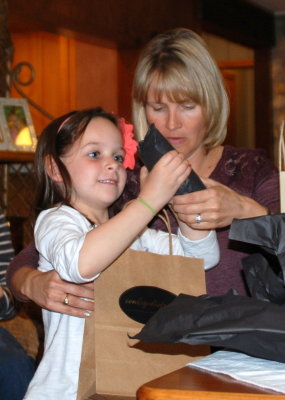Addy helps Angie open her presents