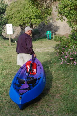Mike helping pull the kayak up from the beach