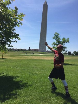 Brooks holding up the Washington Monument