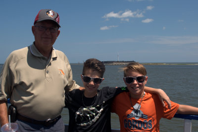 Coach, Carter, and Brooks with Fort Sumter in the background