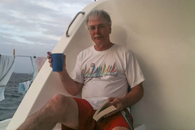 A drink, a book, a boat...life is good