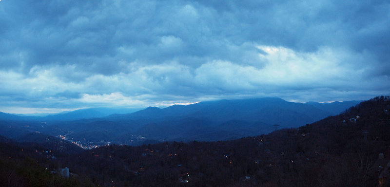 Panorama - Stormy vista at sunrise above the valley