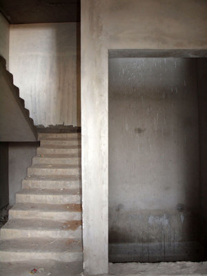 Steps to apartment with elevator shaft next to it