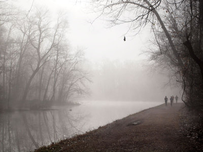 Runners approach in the fog