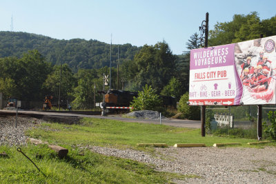 Wilderness Voyageurs sign and freight train from Connellsville