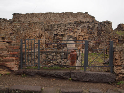 Ruins of a cafeteria on a street in Pompeii