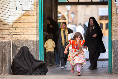 Iranian woman in chador begging
