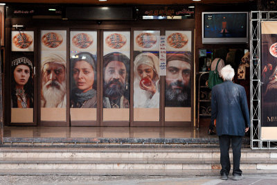 Elderly man outside cinema - Tehran