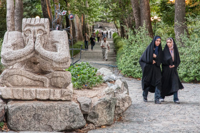 Women walking by sculpture - Tehran