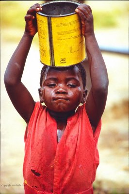 Little Girl Bringing Drinking Water