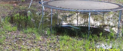 lake under trampoline - bobcat will fix it.jpg