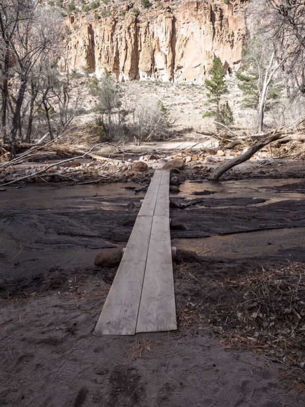 A simple plank bridge replaces permanent bridge destroyed in 2011 flood