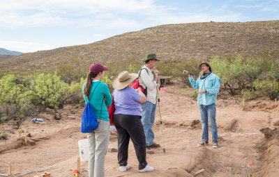 Dr. Bill Walker explains the site to visting anthropologists Drs. Mary Alice Scott, Miriam Chaiken, and Warren DeBoer