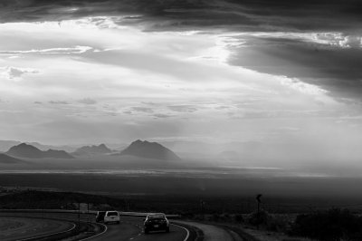 Strange day - winds blowing dust, creating unusual clouds and light, in advance of rain storms scattered all over the region