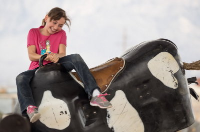 Riding a mechanical bull at Farm and Ranch Museum