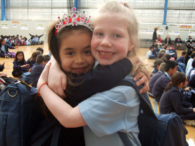 Eva and her good school friend Neeve in the assembly hall.