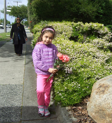Eva on the road to Lola's place with a bunch of roses for her.