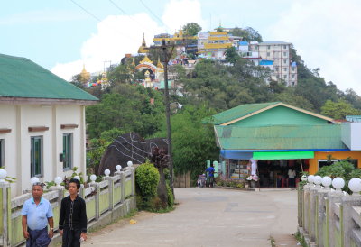 The Kyaiktiyo temple complex in the distance. The entrance is between the two lions
