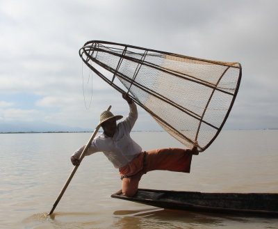 Inle Lake fisherman doing his special pose for the photographer