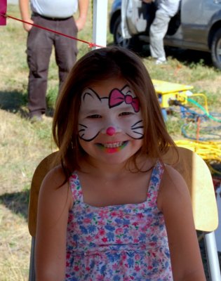 Face painting lady's daughter...she answered to Here kitty, kitty!