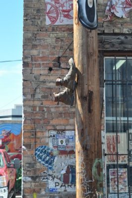 The invisible man walks up a telephone pole