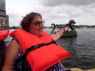 Bathing beauty on the dragon paddle boat