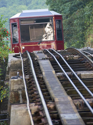 Tram dissappears over the steep incline