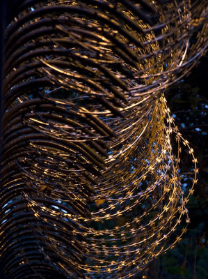 Razor wire around a residence on the peak